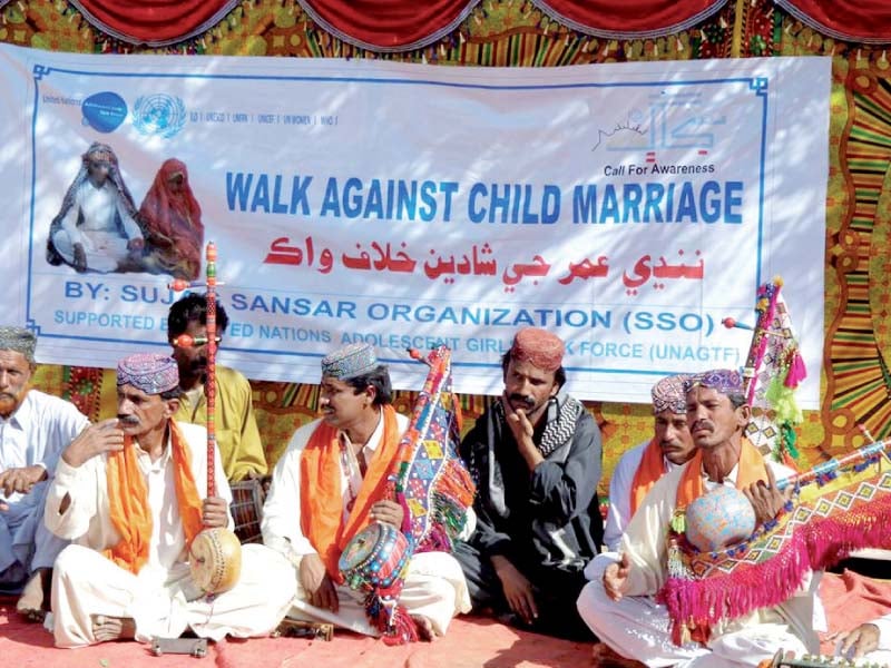 Men from local community gather to raise awareness to end child marriage. PHOTO CREDIT: SSO
