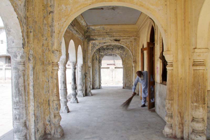 Sayed Bahadar Ali is a self-appointed caretaker at the samadhi. He says he has been living at the samadhi since 1947. PHOTO: ABID NAWAZ/EXPRESS