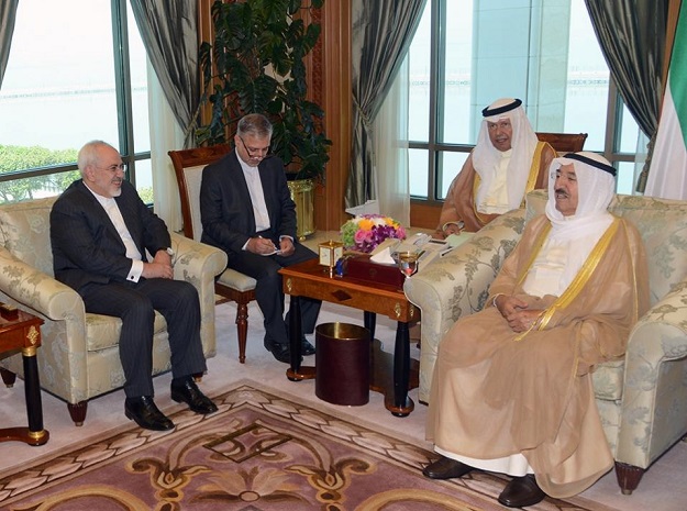 Emir of Kuwait Sheikh Sabah al-Ahmad al-Jaber al-Sabah (R) receiving Iran's Foreign Minister Mohammad Javad Zarif (L) in Kuwait City upon his arrival for a Gulf tour. PHOTO: AFP
