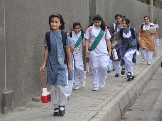 Students seen going to school. PHOTO: MUHAMMAD AZEEM/EXPRESS