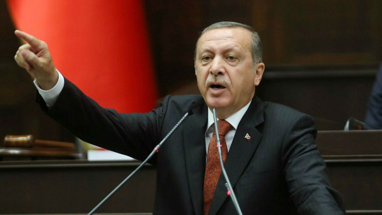 Erdogan told reporters returning with him on a trip to Asia that the Kurdish authorities in northern Iraq should be taking action against the PKK bases there. PHOTO: AFP