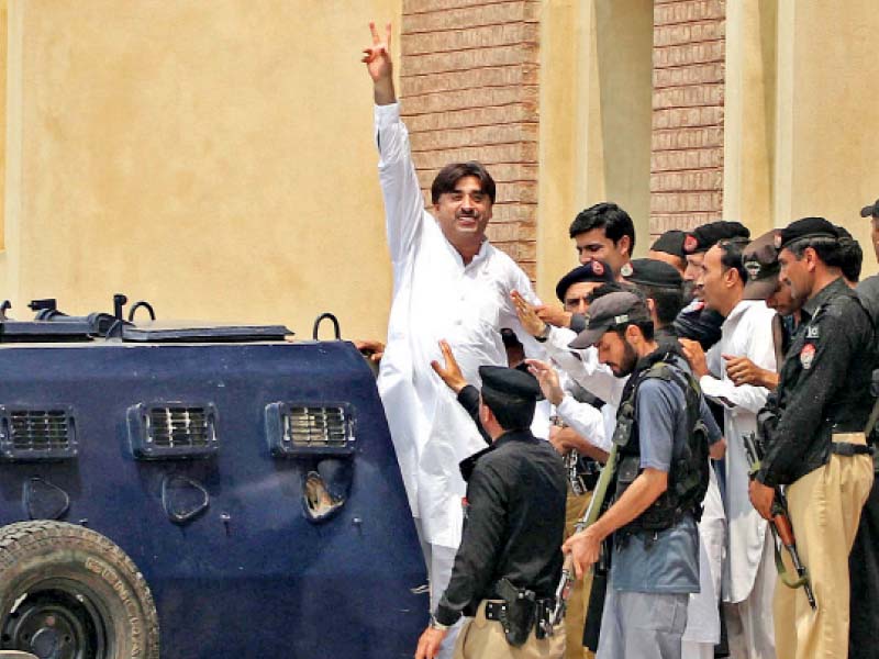 Ziaullah Afridi waves to his supporters after his hearing. PHOTO: PPI