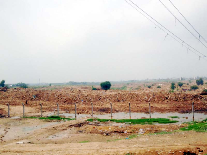 Hundreds of homes once stood at the now levelled I-11 katchi abadi. The site is now fenced and off limits to the public. PHOTO: EBRAHIM UMAR-KHITAB/EXPRESS