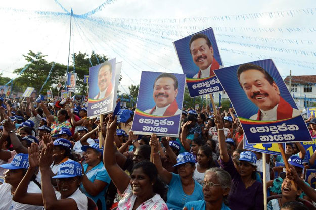 Supporters of former Sri Lankan president and parliamentary candidate Mahinda Rajapakse gather at a rally in Gampaha, on August 14, 2015 PHOTO: AFP