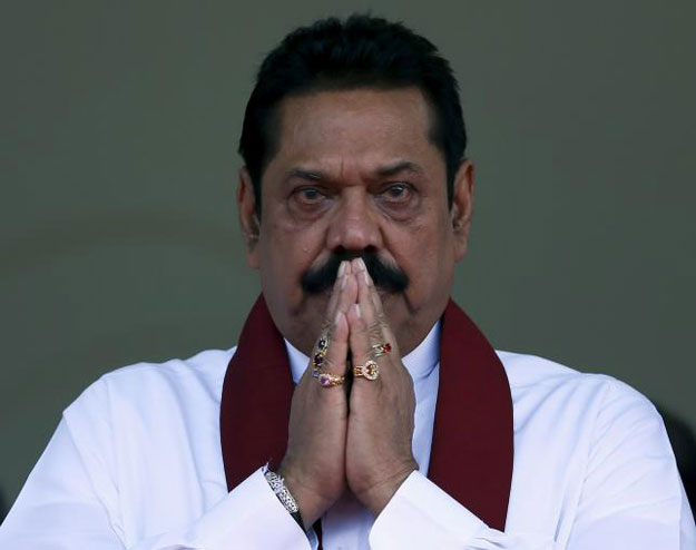 Sri Lanka's former president Mahinda Rajapaksa, who is contesting in the upcoming general election, prays during the launch ceremony of his manifesto, in Colombo July 28, 2015. PHOTO: REUTERS