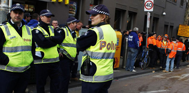 A crowd of several hundred protesters shut down a main intersection in the heart of Melbourne while protesting over the visa checks. PHOTO: AFP