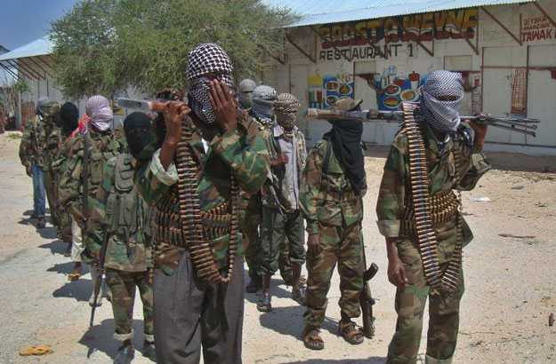 Al Qaeda linked al-Shabab recruits walk down a street on March 5, 2012, in the Deniile district of Somali capital following their graduation. PHOTO: AFP