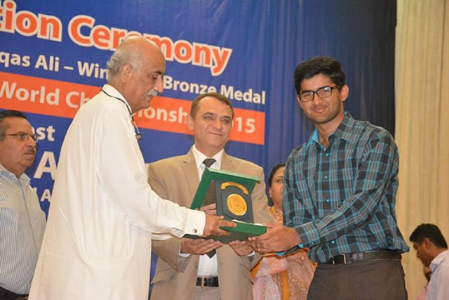 Waqas Ali receiving his award. PHOTO: EXPRESS