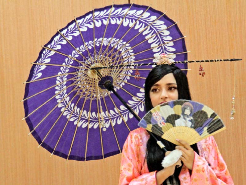 A student is dressed as Princess Kaguya for the cosplay segment at the inauguration of Japanese Film Festival 2015 on Thursday. The event aims to serve as a platform to allow Pakistanis to gain more knowledge about the Japanese culture and strengthen the relationship between the two countries. PHOTO: AYSHA SALEEM/EXPRESS