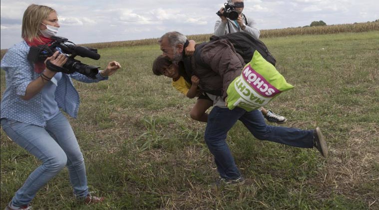 The camerawoman, working for a Hungarian TV news channel was reportedly fired after the video went viral. PHOTO: REUTERS