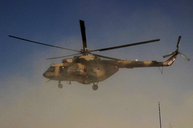 An Afghan helicopter carrying security personnel arrives at the scene of an operation against Taliban insurgents in Kunduz on September 30, 2015. PHOTO: AFP
