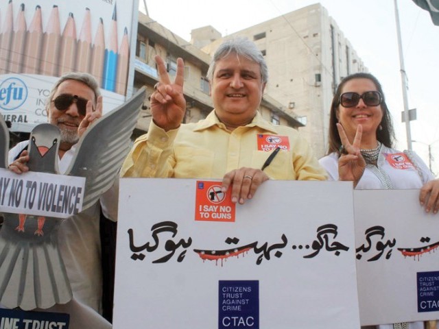 The Citizens Trust Against Crime held a protest at the Metropole Hotel to demand promotion of peace in the city, urging all civilians to voice their concerns over the law and order situation in Karachi. PHOTO: PPI