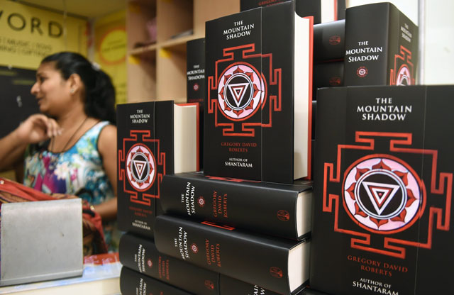 Copies of Gregory David Roberts new book "The Mountain Shadow" are displayed at a book store in Mumbai on October 13, 2015. A long-awaited sequel to "Shantaram" went on sale on October 13, 12 years after the novel about an escaped Australian convict in India became a huge backpacker hit, selling four million copies worldwide.  PHOTO: AFP
