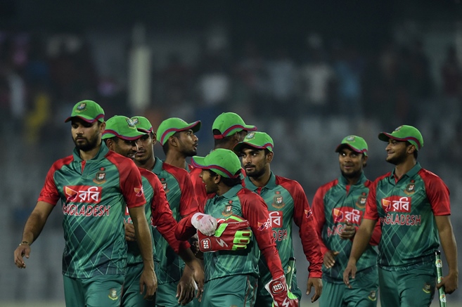 Bangladesh cricketers walk off the field after winning the first ODI match between Bangladesh and Zimbabwe at the Sher-e Bangla National Stadium in Dhaka on November 7, 2015. PHOTO: AFP