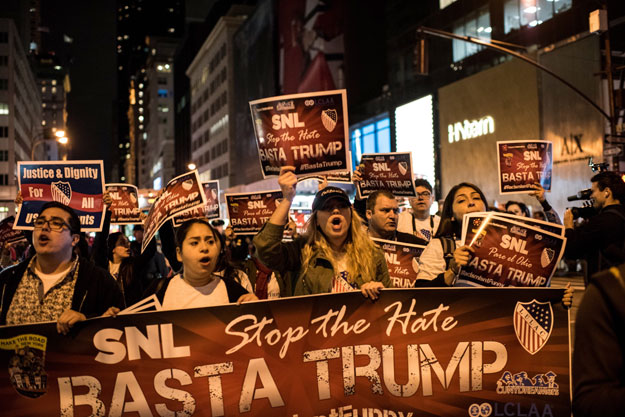 Members of Latino organizations march from the Trump Tower to NBC studios during a rally against Republican Presidential candidate Donald Trump on November 7, 2015 in New York City. PHOTO: AFP