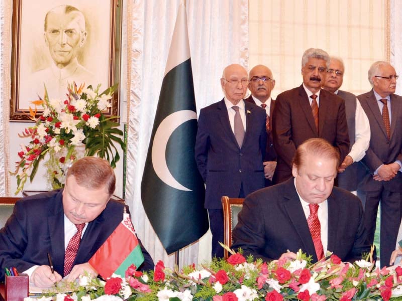 Premier Nawaz and Belarus PM Andrey Kobyakov sign an MoU . PHOTO: INP