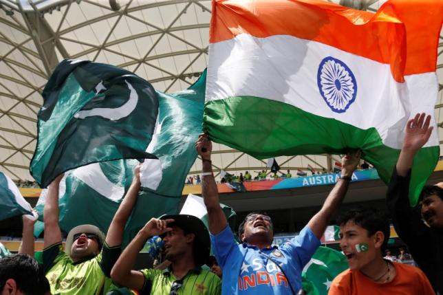 Fans of Pakistan's cricket team (L) and India's (R) cheer in the stands before Pakistan's Cricket World Cup match against India in Adelaide on February 15, 2015. PHOTO: REUTERS