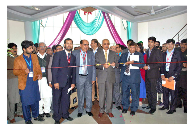 UAF VC Dr. Iqrar Ahmed inaugurating the Expo Seed Center at UAF. PHOTO: APP