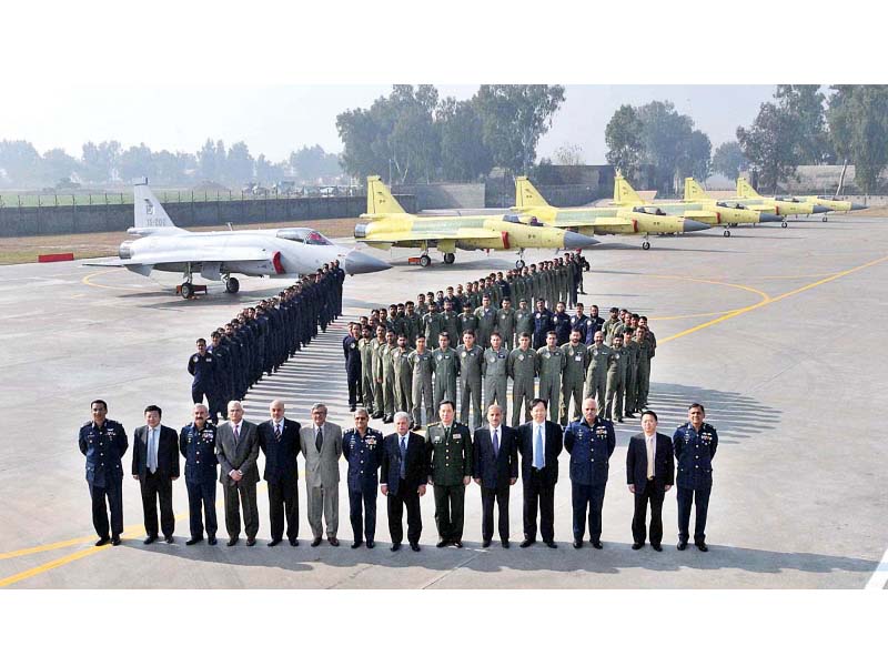 Minister for Defence Production Rana Tanveer and Chief of Air Staff Air Marshal Sohail Aman along with other senior officials pose for a group photograph at Pakistan Aeronautical Complex. PHOTO: APP