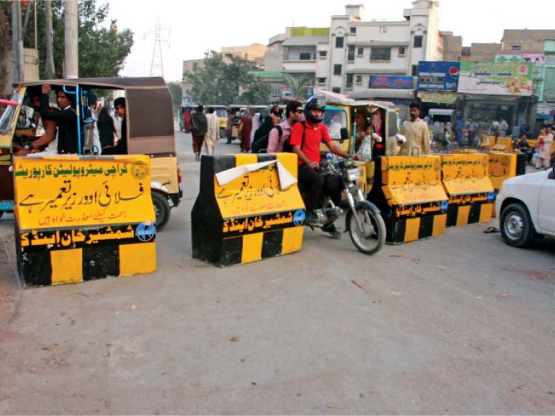 The main road leading to the Institute of Business Management was blocked on Monday to make way for construction work on the Korangi Crossing flyover. PHOTO: ATHAR KHAN/EXPRESS