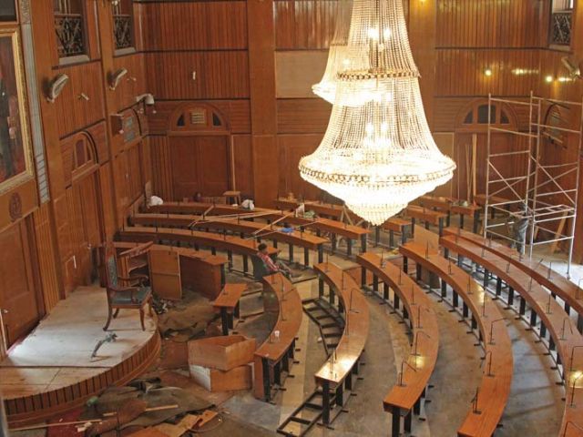 Workers have been deployed at KMC’s old council hall to prepare it for its new council members elected in the recent LG elections. PHOTO: AYSHA SALEEM/EXPRESS
