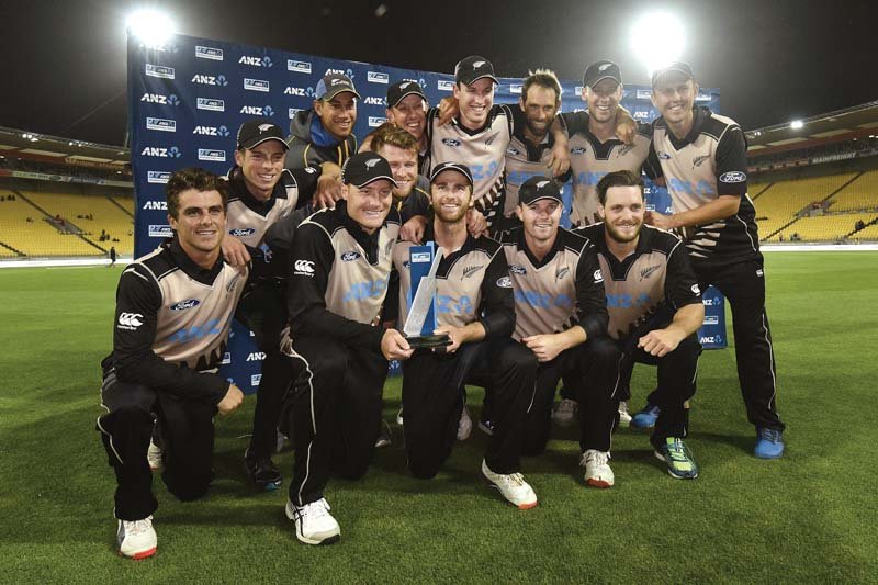 New Zealand players pose with the  ANZ T20 trophy after their collective effort  allowed them to condemn Pakistan to a humiliating defeat in the decider. PHOTO: AFP