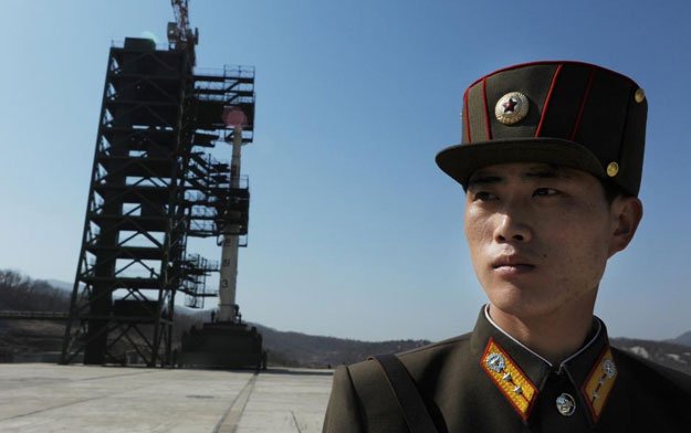 A North Korean soldier stands guard at the Sohae Satellite Launch Station in Dongchang-Ri on April 8, 2012 PHOTO: AFP