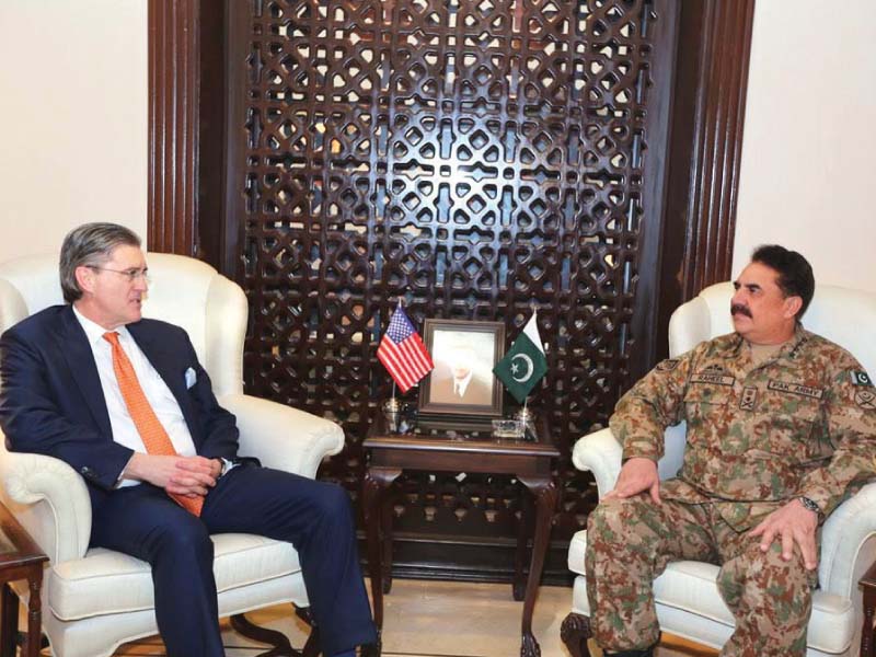 US special representative Richard Olson and General Raheel Sharif talk during a meeting at GHQ in Rawalpindi on Saturday. PHOTO: ISPR