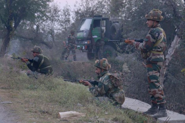 Indian Army personnel stand alert near the Air Force Base in Pathankot, on January 2, 2016, during an ongoing attack on the base by suspected militants. PHOTO: AFP