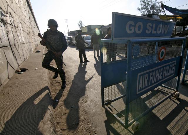 Indian security personnel stand guard next to a barricade outside the Indian Air Force (IAF) base at Pathankot in Punjab, India, January 2, 2016. PHOTO: REUTERS