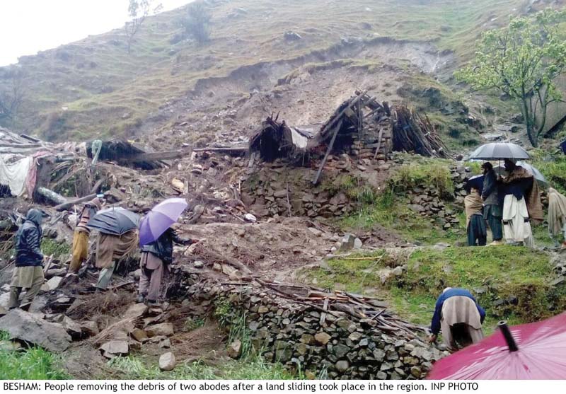 People in Shangla town of Khyber-Pakhtunkhwa help their neighbours whose abode was destroyed by a landslide triggered by torrential rain. PHOTO: INP