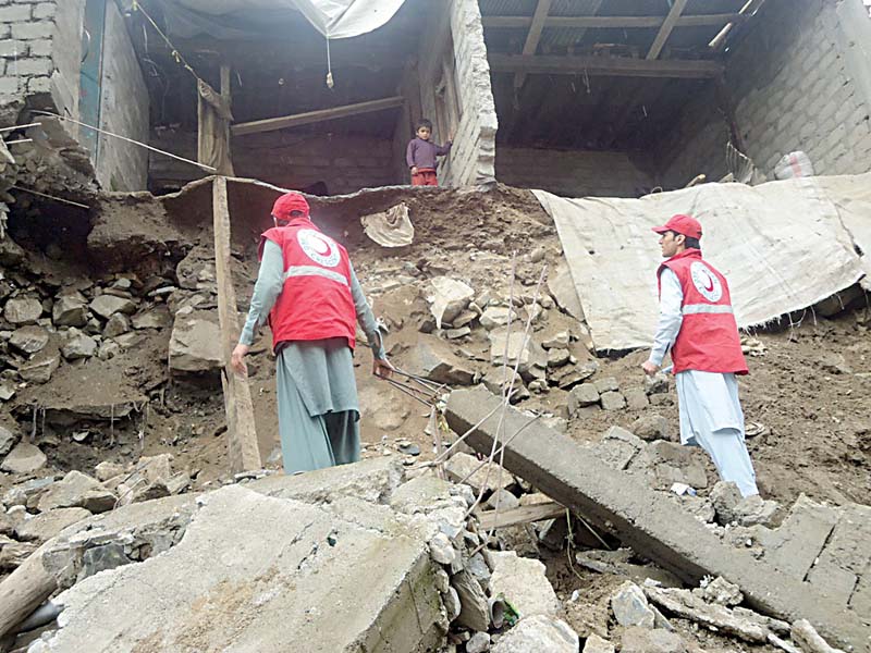 Rescue work is under way at Othar Nala, Kohistan following a massive landslide. PHOTO: SYED NOMAN SHAH