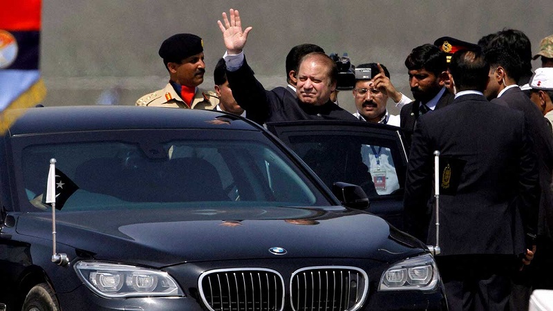 A file photo of Prime Minister Nawaz Sharif waving as he sits in his car. PHOTO: AFP