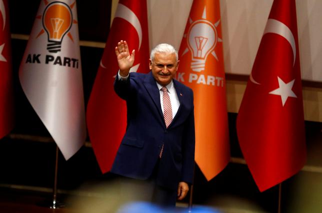 Turkey's likely next prime minister and incoming leader of the ruling AK Party Binali Yildirim greets party members during a meeting in Ankara, Turkey, May 19, 2016. PHOTO: REUTERS