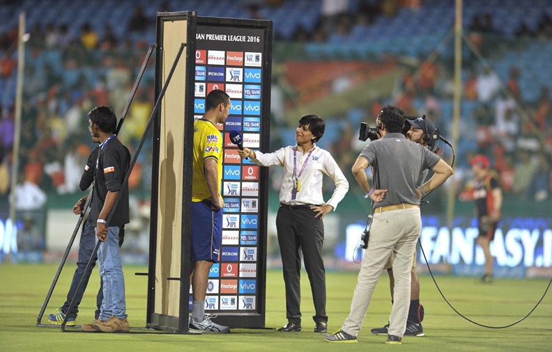 In this photograph taken on May 22, 2016, Indian cricket commentator and former women's cricket team captain Anjum Chopra (C) interviews Delhi Daredevils Nathan Coulter-Nile ahead of the 2016 Indian Premier League (IPL) Twenty20 cricket match at Shaheed Veer Narayan Singh International Cricket Stadium in Raipur. PHOTO: AFP