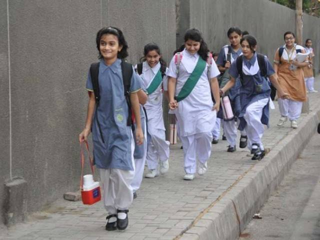 Students seen going to school. PHOTO: MUHAMMAD AZEEM/EXPRESS