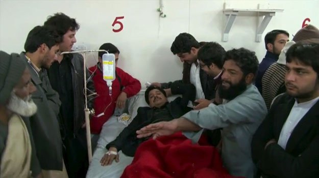 Relatives and friends surround a man, injured in a militant attack at the Bacha Khan University, at a hospital in Charsadda in this still image taken from a video on January 20, 2016. PHOTO: REUTERS