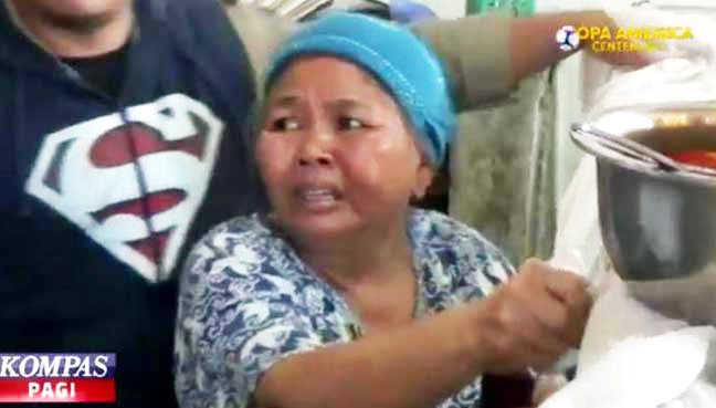 53-year-old desperately begging officials not to confiscate her food.