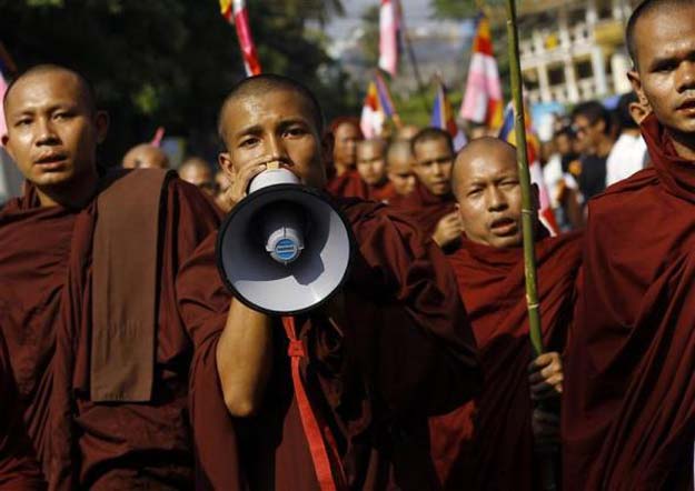 Buddhist monks take part in a protest in support of demonstrators who were injured during a copper mine riot, in Yangon December 12, 2012. PHOTO: REUTERS/FILE