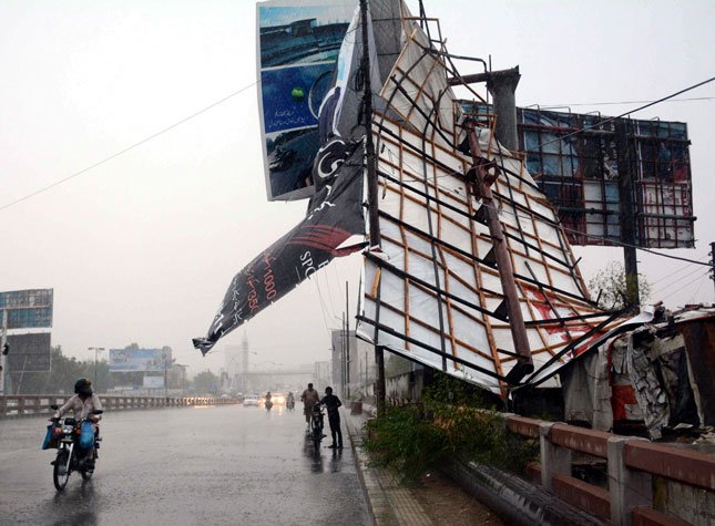 Part of the roof caved in when the hoarding fell. PHOTO: EXPRESS/ RASHID AJMERI