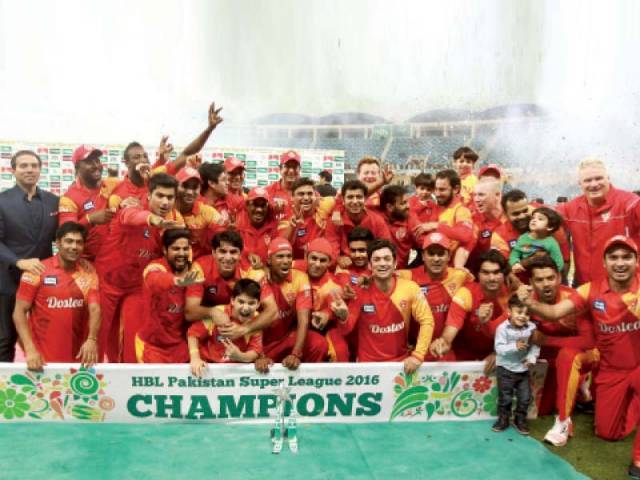 Islamabad United pose with the trophy of the inaugural edition of Pakistan Super League in Dubai. PHOTO: AFP