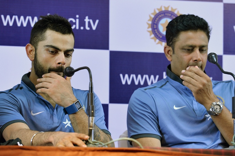 Indian Test cricket team captain Virat Kohli and head coach Anil Kumble (R) take part in a press conference in Bangalore on July 4, 2016. PHOTO: AFP