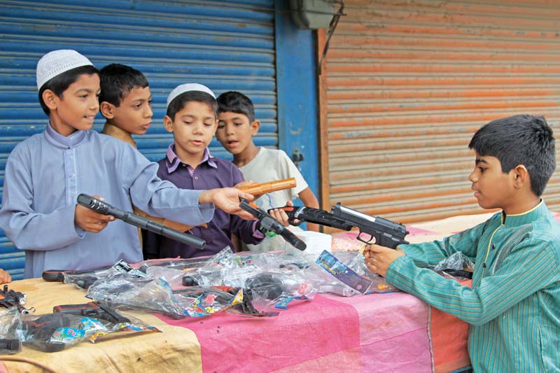 Activists warn of the negative effects of letting children play with guns. PHOTO: AYSHA SALEEM/EXPRESS