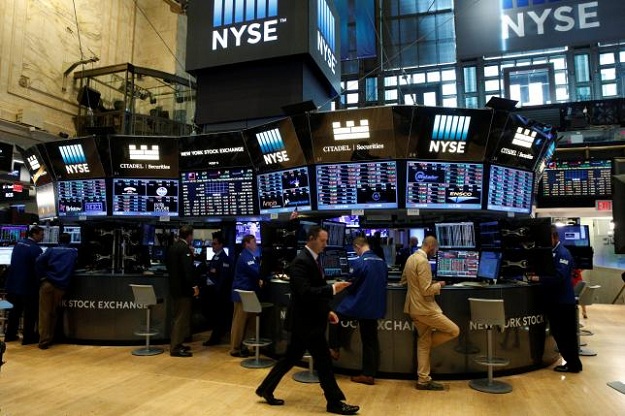 Traders work at the Citadel Securities post on the floor of the New York Stock Exchange. PHOTO: REUTERS