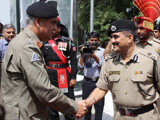 In this file photo, DG Punjab Rangers sahkes hand with the Indian BSF official at Wagah Border. PHOTO: AFP