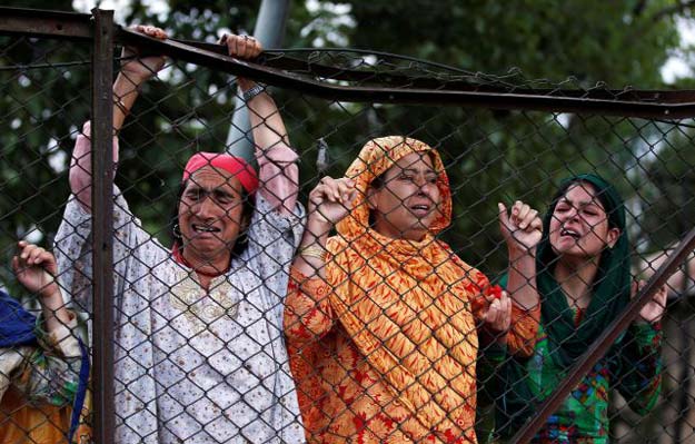 Kashmiri women mourn the death of Burhan Wani, during his funeral in Tral, south of Srinagar PHOTO: REUTERS