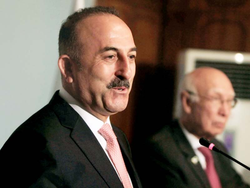 Turkish Foreign Minister Mevlut Cavusoglu speaks at a news conference with Foreign Affairs Adviser Sartaj Aziz in Islamabad on Tuesday. PHOTO: REUTERS