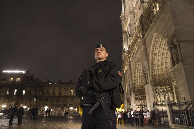 A police man on guard outside Notre Dame Cathedral in the centre of Paris. PHOTO: AFP/File