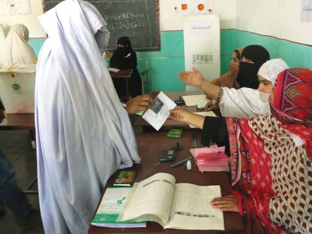Some Malir residents run from pillar to post to cast their vote. PHOTO: EXPRESS