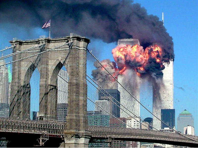 The second tower of the World Trade Center bursts into flames after being hit by a hijacked airplane in New York in this September 11, 2001 file photograph. Al Qaeda leader Osama bin Laden was killed in a firefight with U.S. forces in Pakistan on May 1, 2011, ending a nearly 10-year worldwide hunt for the mastermind of the Sept. 11 attacks. The Brooklyn bridge is seen in the foreground. PHOTO: REUTERS